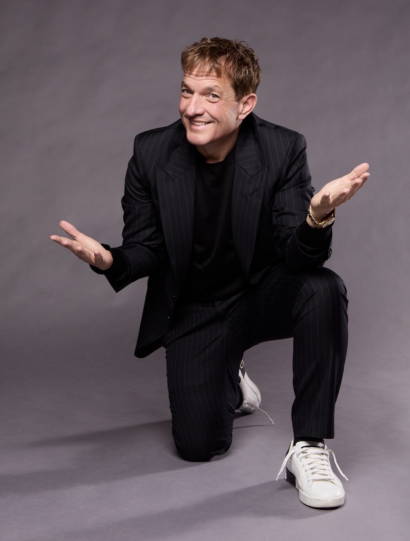 Jeff Beacher in a black pinstripe suit